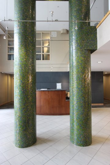 Green Mosaic Columns in the Foyer of a building in Discovery