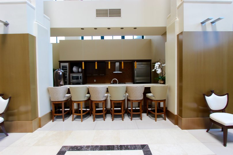 THE HOUSE IN THE ELECTRA WITH DINING HALL WITH DINING TABLES AND CHAIRS.