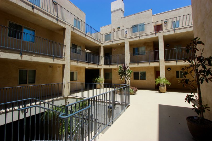A sunny day in the area of Hawthorn Place, outside, courtyard, balconies, potted plants, stairs