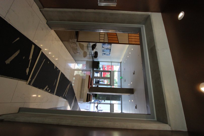 black carpet arranged in front of call with furniture in icon