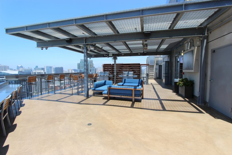 A sunny day in the area of Ico, outside, patio, covered, chairs, tables, couches, door