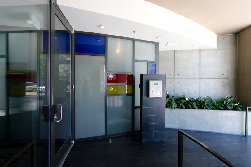 An entrance of a building in the M2i with beautiful plants.