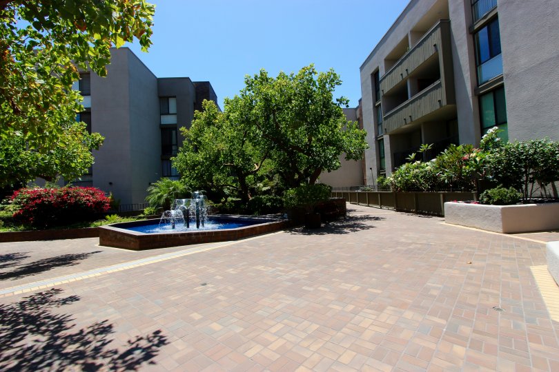 Mature landscaping, with a beautiful waterfall as a centerpoint.