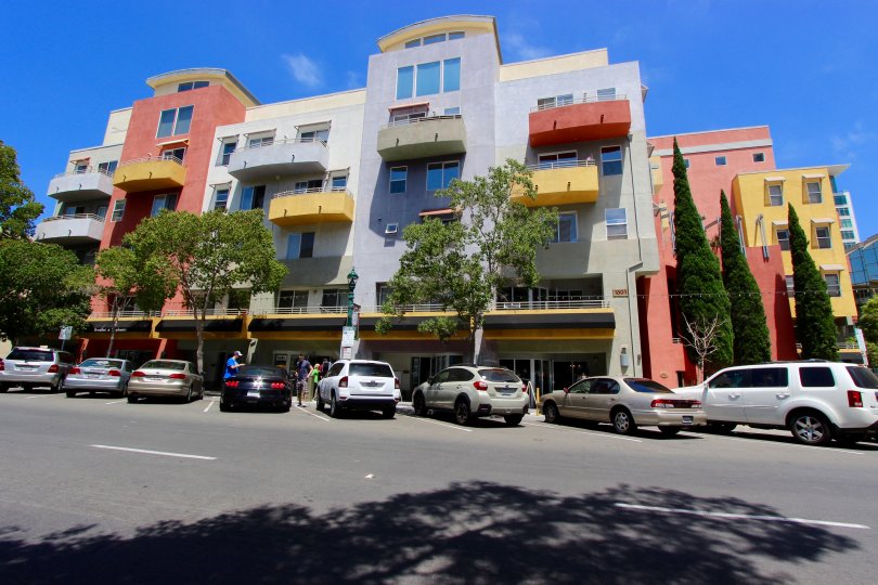 Balconies in red, yellow, and gray sit on a the Palermo building