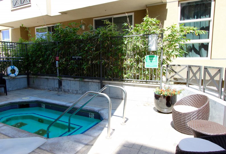Some chairs and plants by a hot tub at Park Blvd West in downtown San Diego, CA