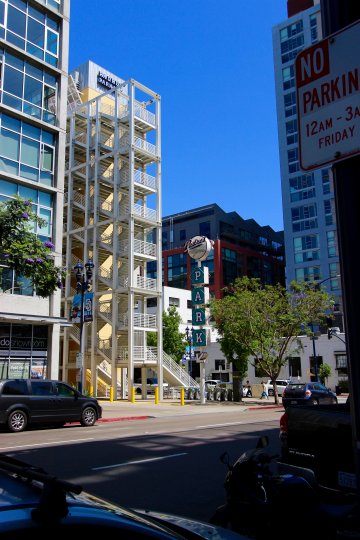 A large building with multiple floors meant for parking in Smart Corner community.