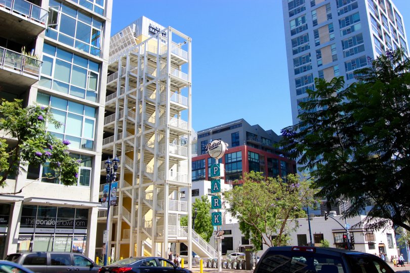 a view of Smart Corner showing the exterior of downtown buildings and a parking lot.