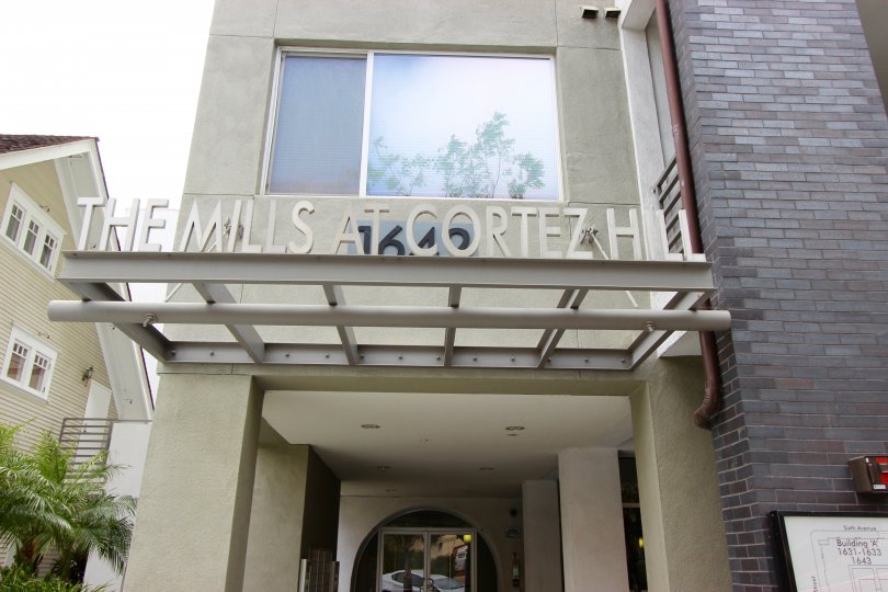 A sunny day in the area of The Mills at Cortez Hill, entrance, window, welcome sign