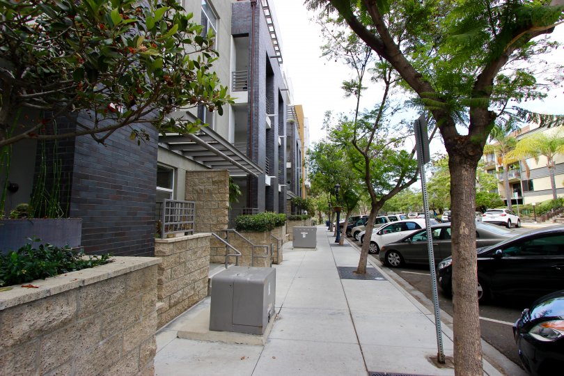 Sidewalk between buildings and parking spaces in The Mills at Cortez Hill, in Downtown San Diego, California.