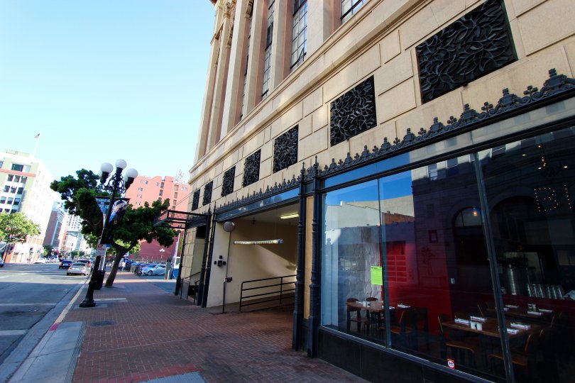 A sunny day in the area of Union Square, outside, palm tree, cafe, window, sidewalk