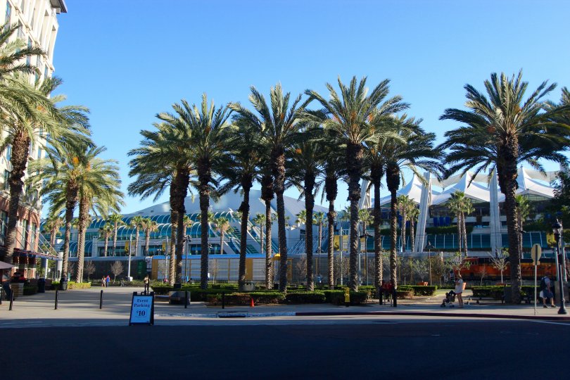A sunny day in the area of Union Square, outd=side, palm trees, street, sidewalk, parking sign