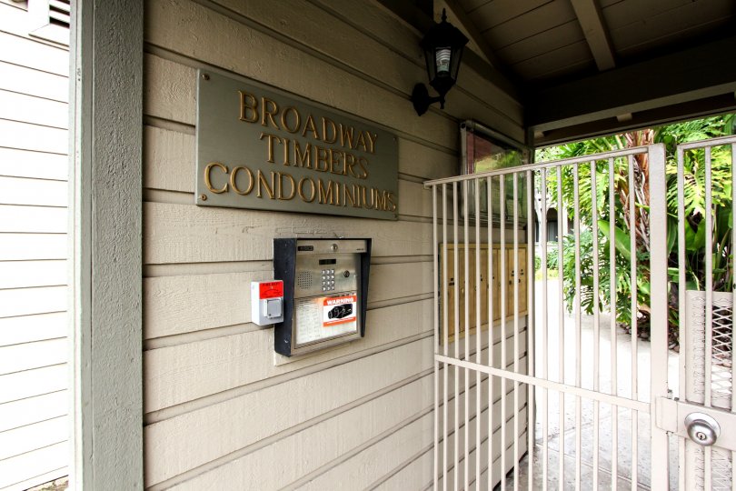 A close up shot of the front office intercom and gate of the Broadway Timbers in El Cajon, California.