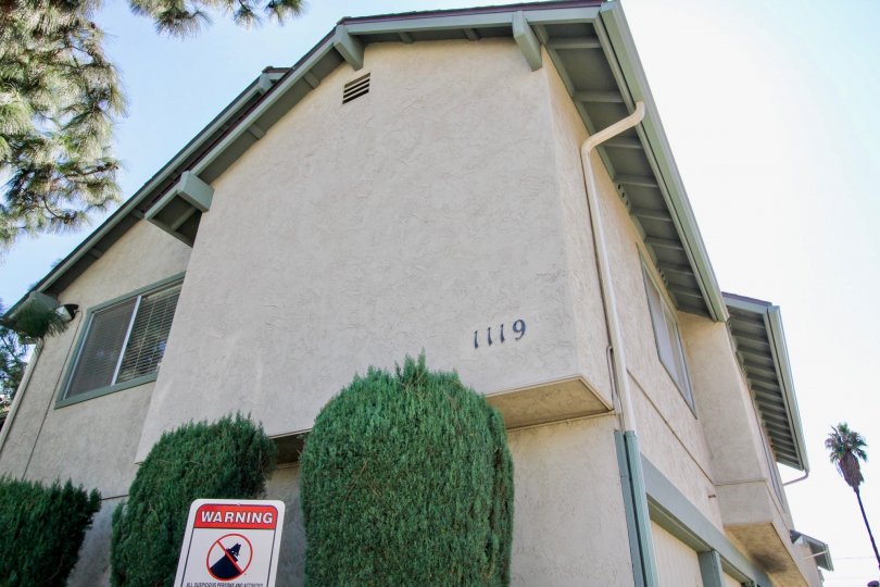 Two story residential building with trees at Centaur Villas in El Cajon California