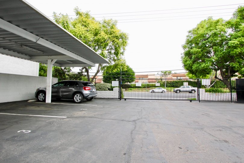 A BEAUTIFUL BIG VILLA AND A NICE CAR AND IT LOOK LIKE A HUGE ONE FOR SO MANY PERSONS