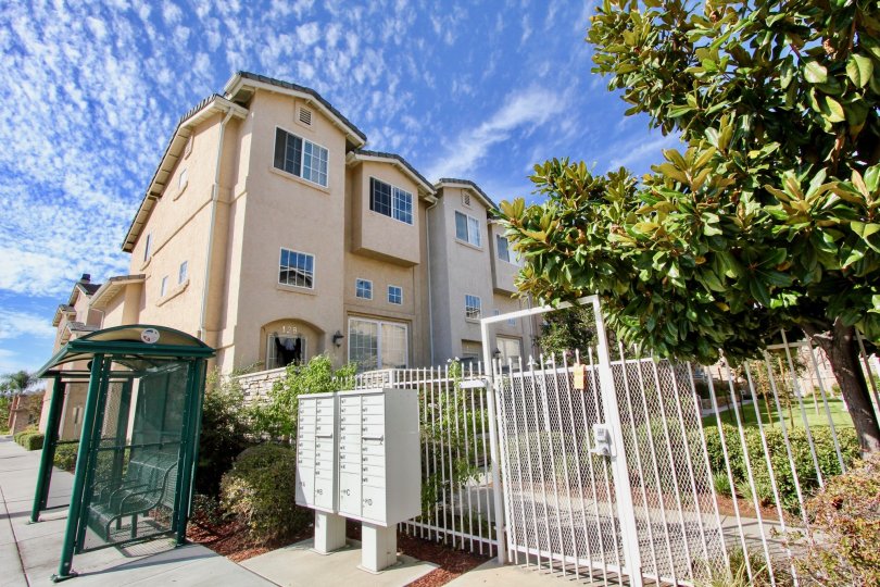 White fence surrounded town homes at Promenade Square in El Cajon California