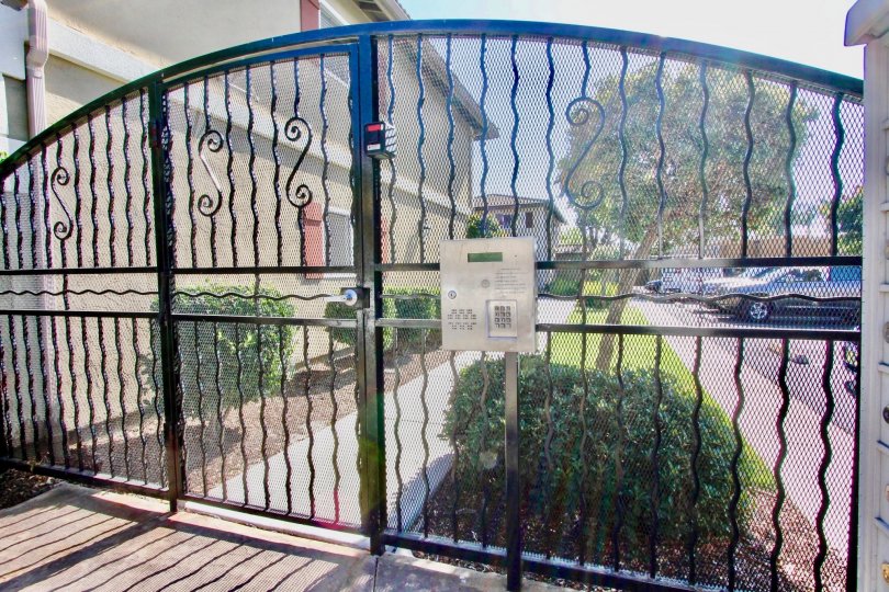 Metal security gate with keypad at Woodland Village in El Cajon California