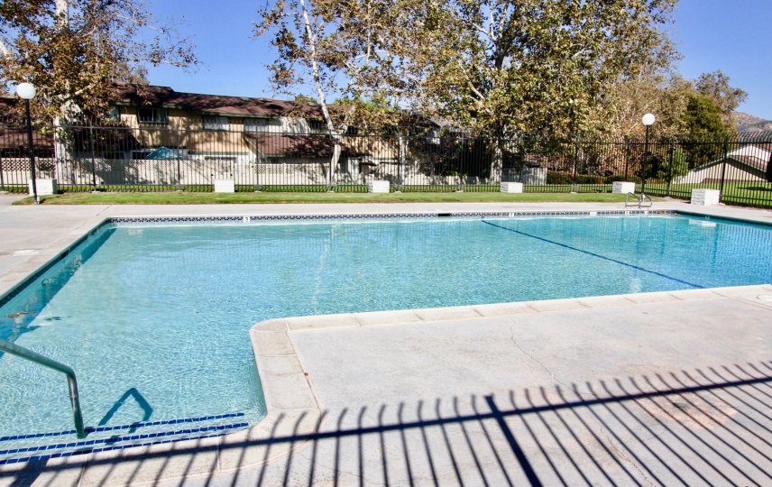 Large swimming pool surrounded by gate at Escondido Hills in Escondido California
