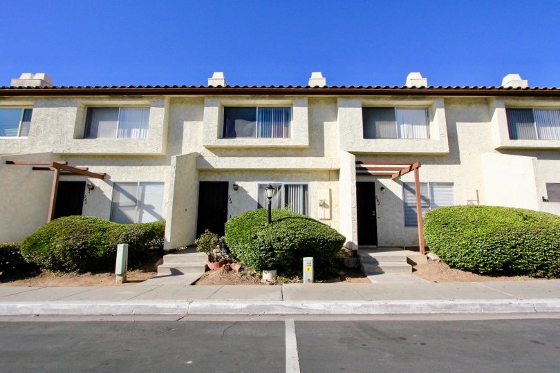 Front doors to apartments and walkways to Villas Espanas in Escondido, Ca.