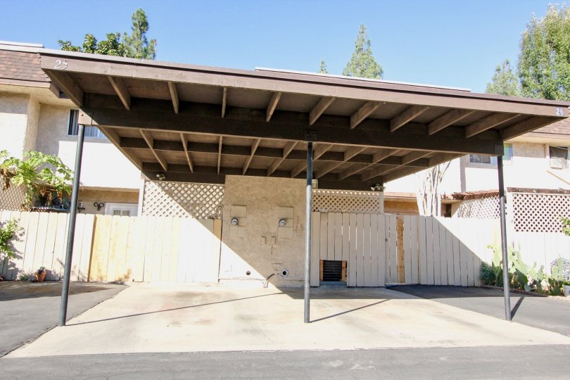 Covered parking area near wooden fence at Villa Grande in Escondido California