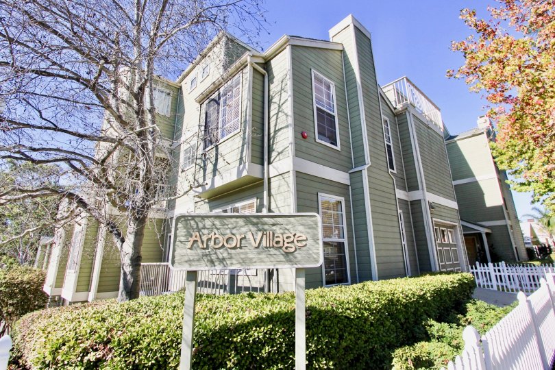 Nice sunny day in Arbor Village with garden and trees near a villa of Hillcrest