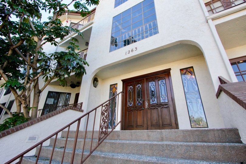 The Apartment in Burgundy House has trees and stairs on sunny day