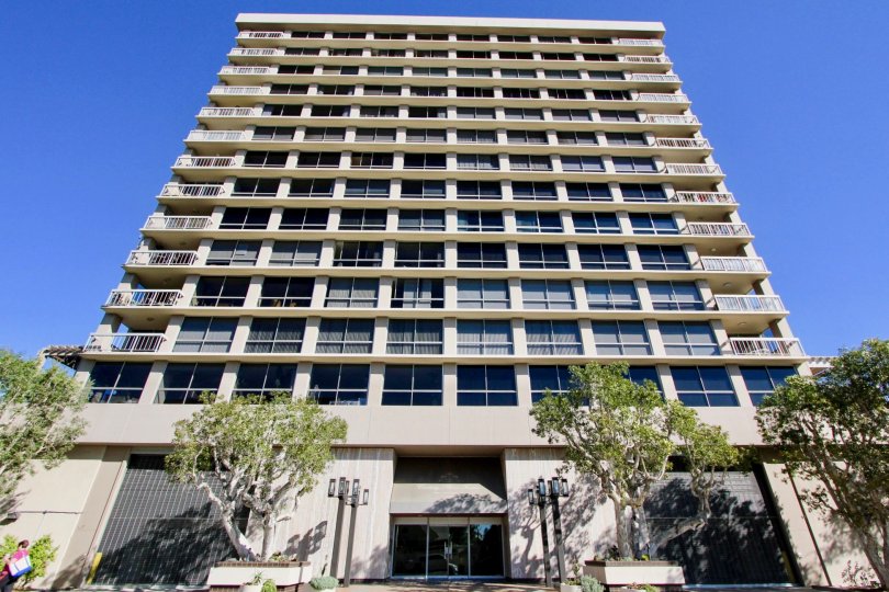 a multistory building with organised architecture, light painted on a sunny day