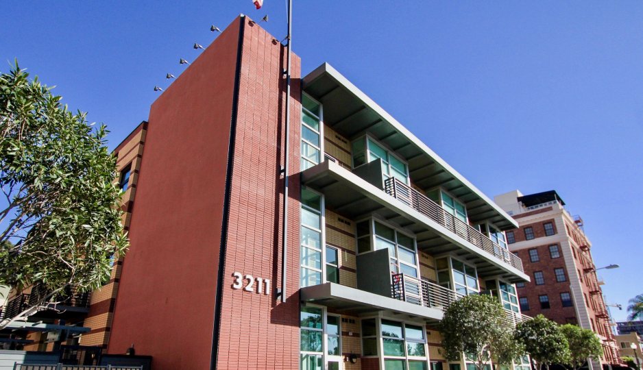 Villa with trees on a sunny day in Fifth Avenue Lofts of Hilcrest