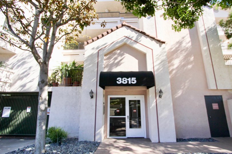 The Building with number 3815 and has light lamps is attached both side to the wall