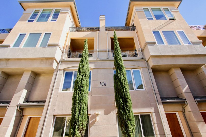 A sunny day in the Wellington Square with residential apartment and trees.