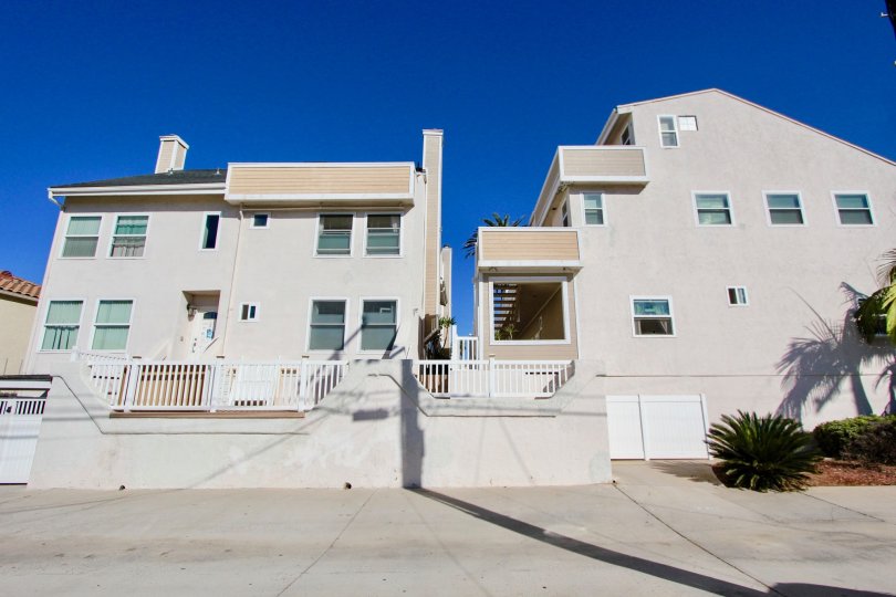 Residential buildings with fence at Sandcastle Townhomes in Imperial Beach California