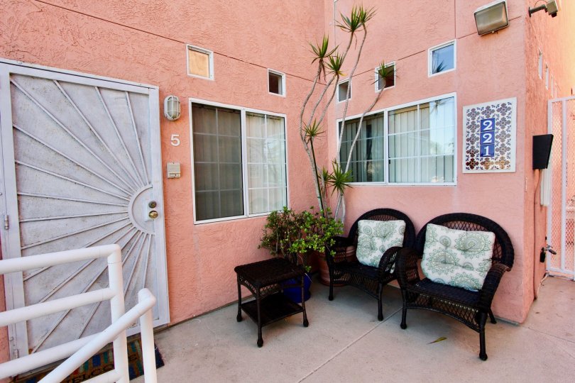 Pink apartment patio in Seaside Villas with chairs