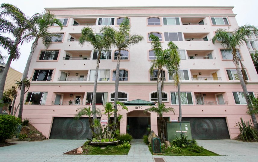 An upscale, five story apartment complex, surrounded by beautiful palm trees, at 1039 Coast Blvd. South in the city of La Jolla, California.