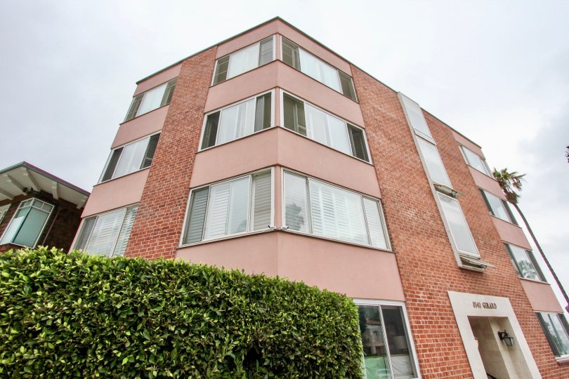 Four story brick building located at 8040 Girard Condos in La Jolla CA