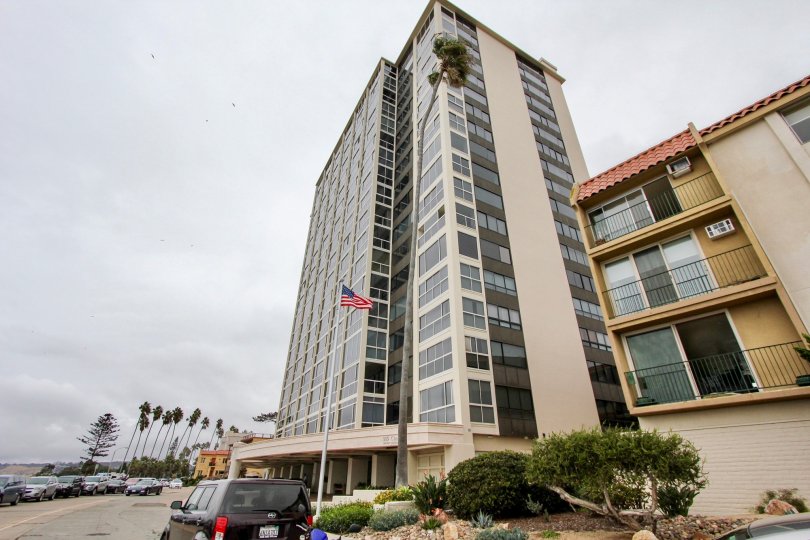 Residential high rise wit tall American flag at 939 Coast in La Jolla CA
