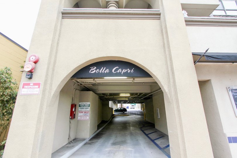 Front view of Bella Capri has warning board and alarm ring and has a facility of car parking