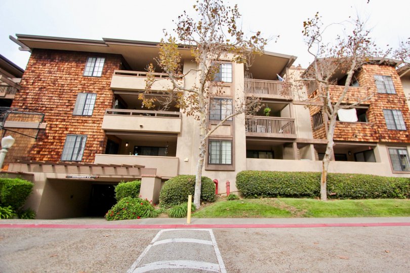 Four story wooden building with an underground parking lot in Boardwalk in La Jolla CA