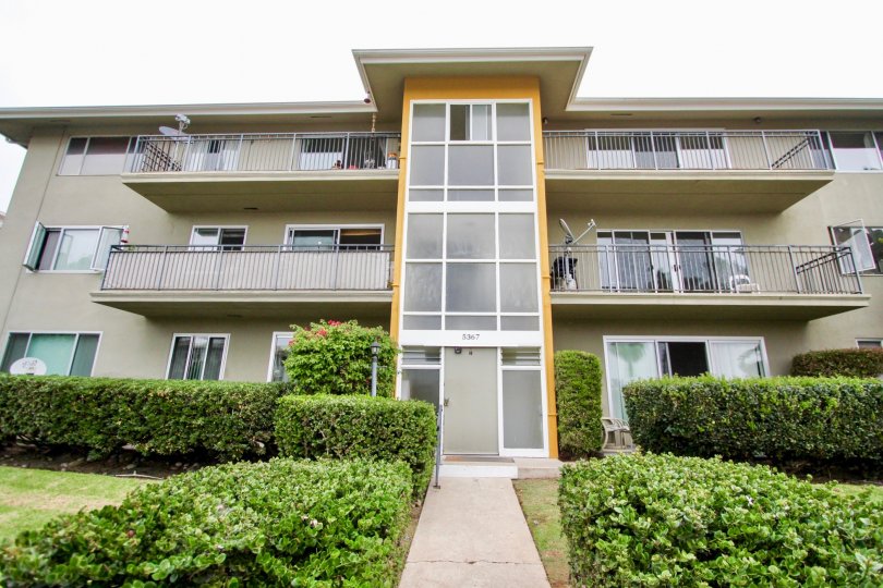 Thre story housing with walkway and plants at Capri Aire in La Jolla CA