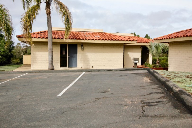 Single story housing near parking spaces inside Coromandel Park in La Jolla CA