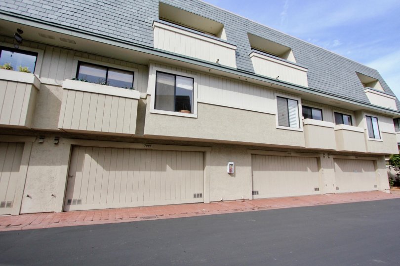 A building with all garages on the first floor located in Del Charro Woods community.