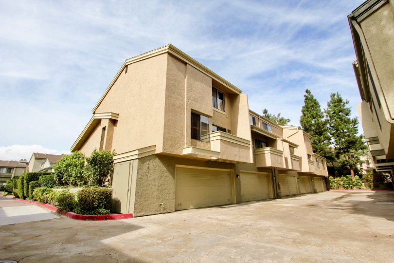 Three story brown condominiums inside the Eastbluff community in La Jolla CA