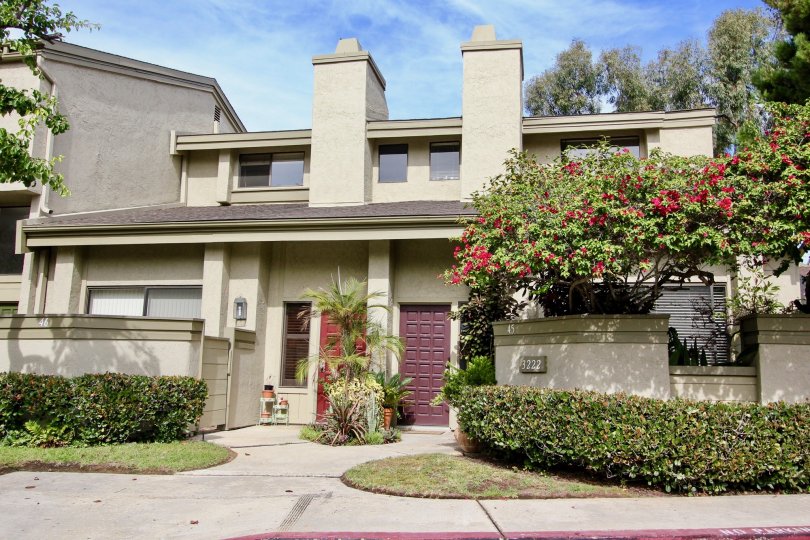 Red and brown doors on residence inside Eastbluff in La Jolla CA