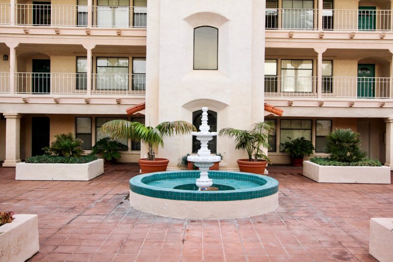 Three story housing & fountain inside La Flor De La Jolla in La Jolla CA