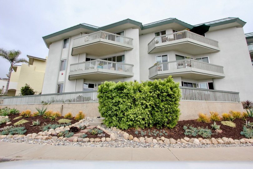 Tall condos with gray railing inside La Jolla Chelsea in La Jolla CA