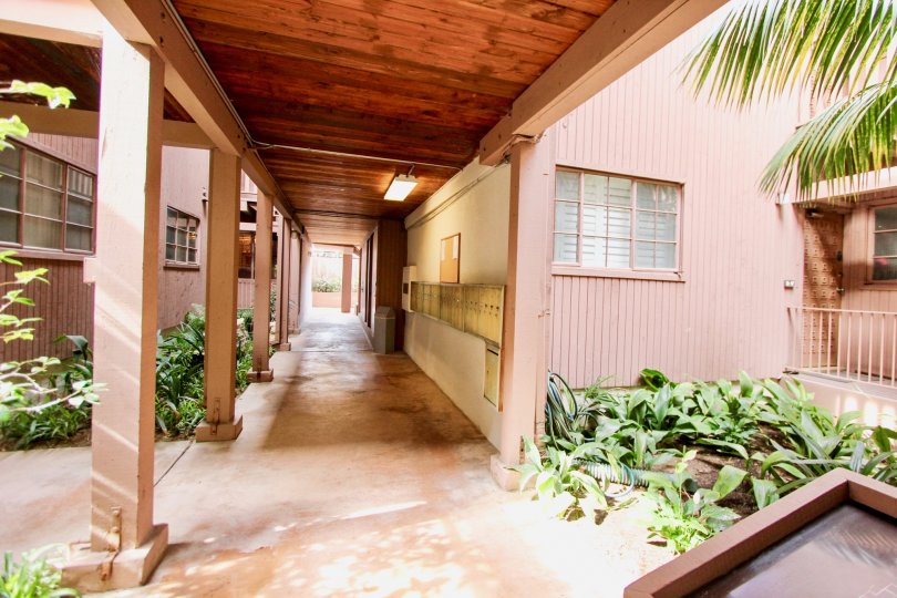 Long pink walkway with a covered walkway in La Jolla Racquet Club in La Jolla CA