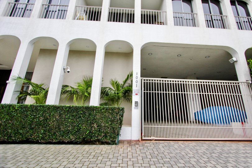 Several buildings in La Jolla Seville with palm trees and archways