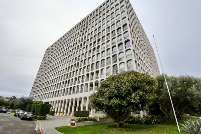 Tall housing structure with many trees at La Jolla Seville in La Jolla CA