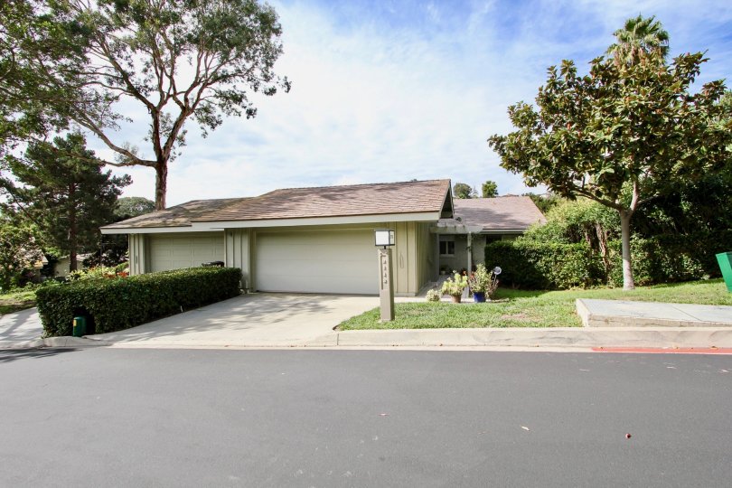 A sunny day in the area of Mount La Jolla area single family home, garage, trees
