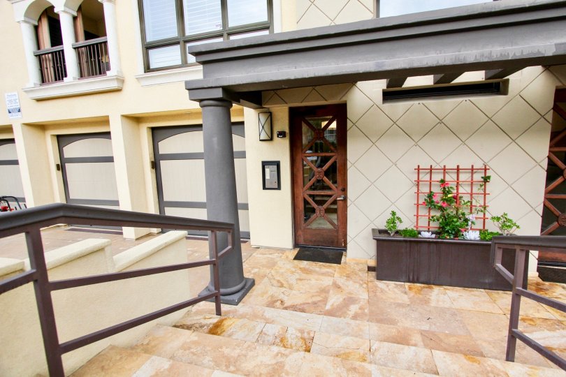 Brown wooden door with cross pattern at Positano in La Jolla CA