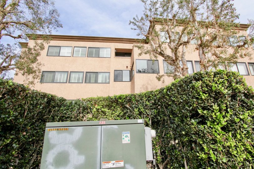 Electrical box down below a pink condo high rise inside Sandpiper in La Jolla CA