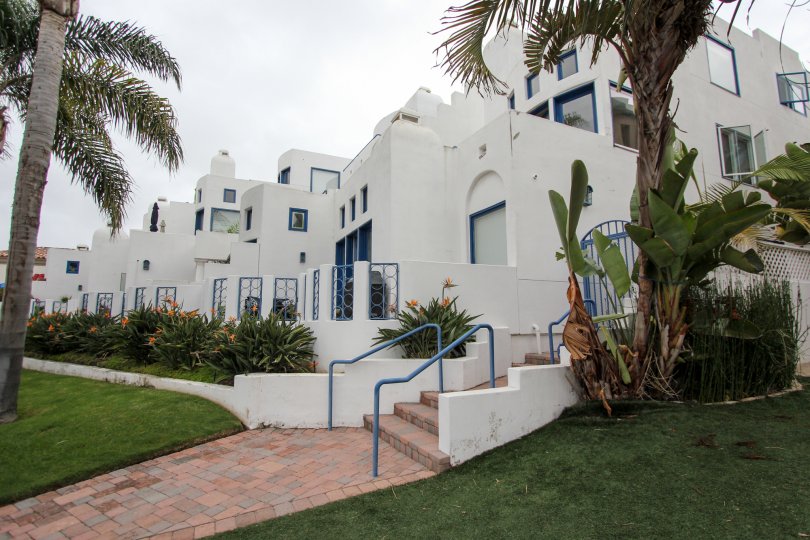 Pink brick stairway leading to white residences inside Santorini West in la JOlla CA